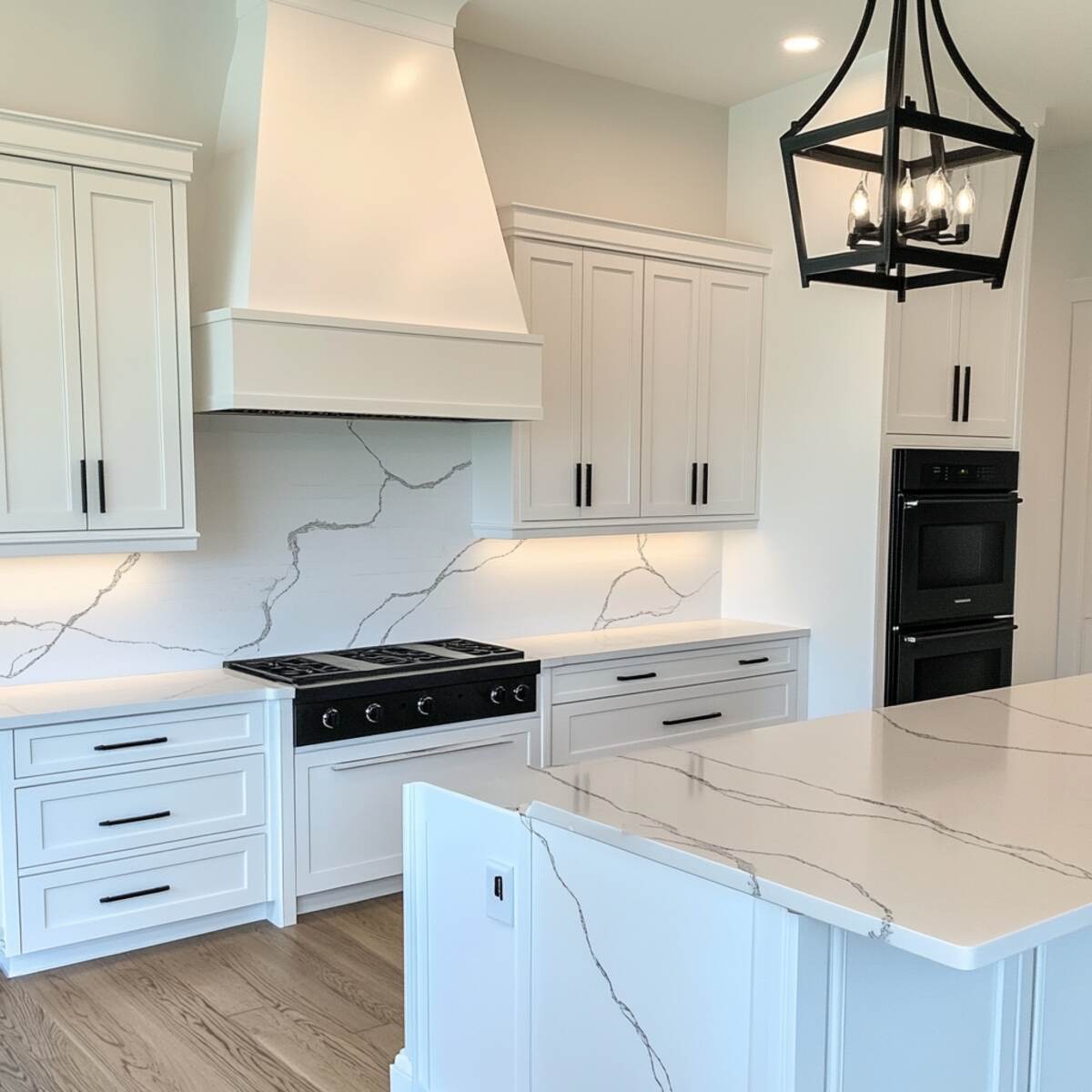 All-white kitchen with black hardware