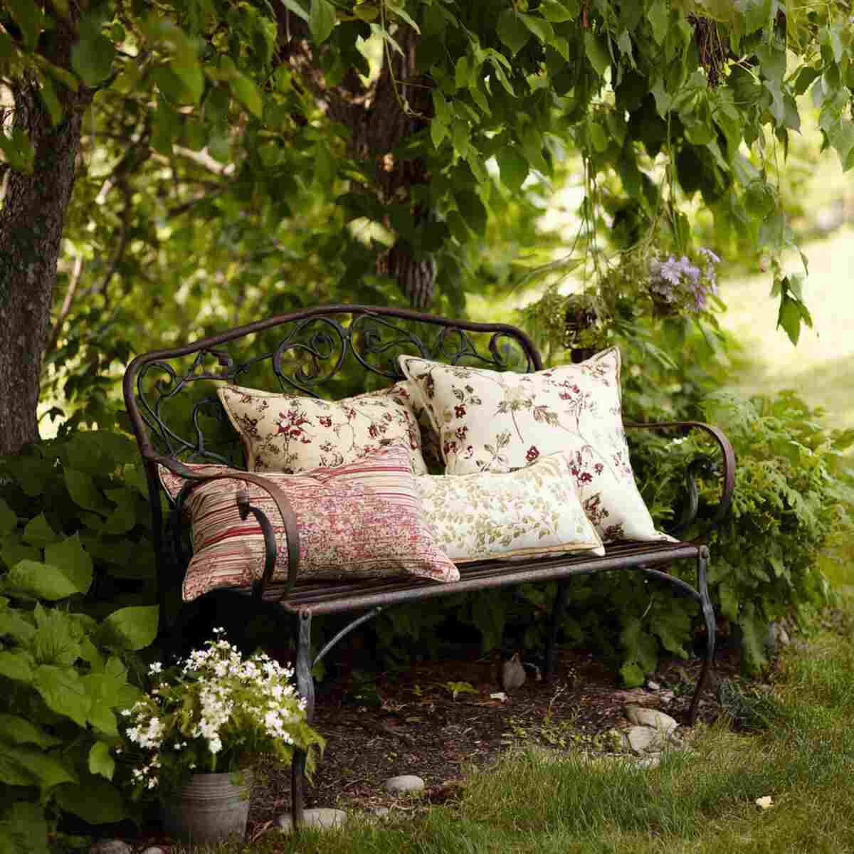 Vintage Iron Bench with Floral Pillows