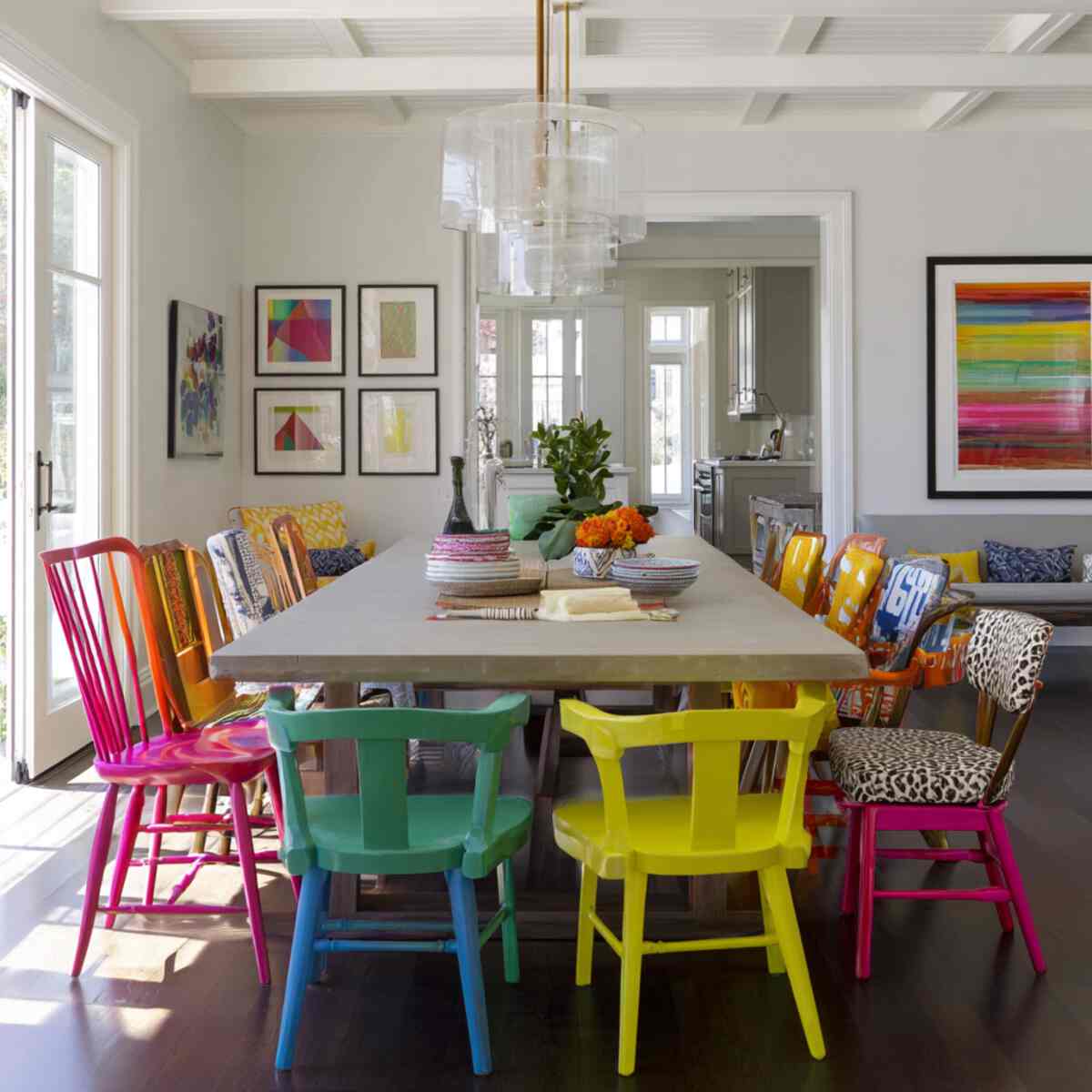 Bold Colorful Chairs Around a Neutral Table