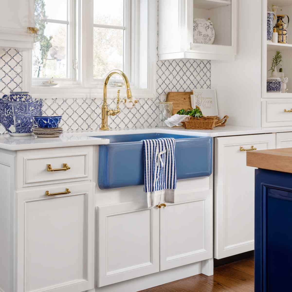 Blue Enamel Farmhouse Sink with White Cabinetry